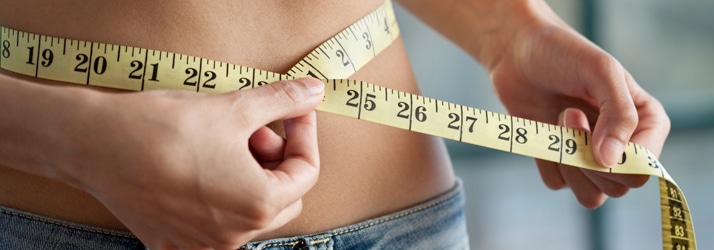 Woman-Measuring-Waist Woman Measuring Waist