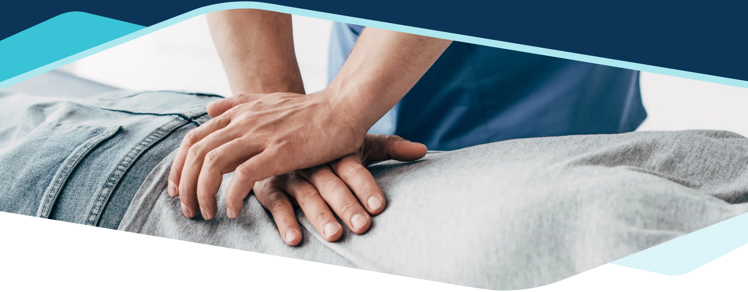 A lower back adjustment being administered by a chiropractor