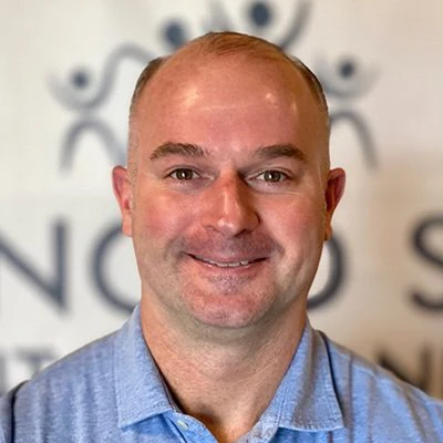 A headshot photo of Dr. Troy Naftzger
