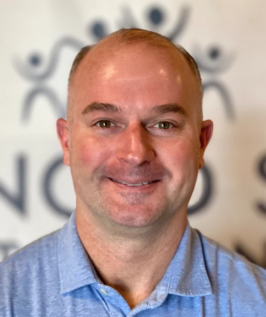 A headshot photo of physical therapy specialist Troy Naftzger