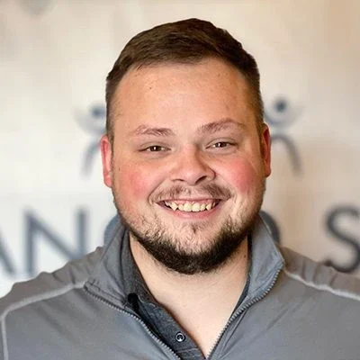 A headshot photo of Kyle Hall