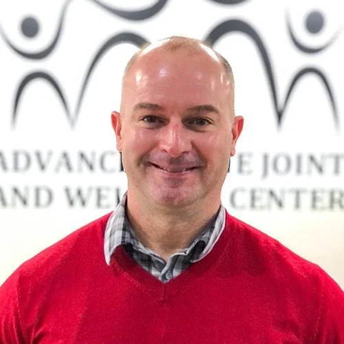 Dr. Troy Naftzger posing for a headshot photo
